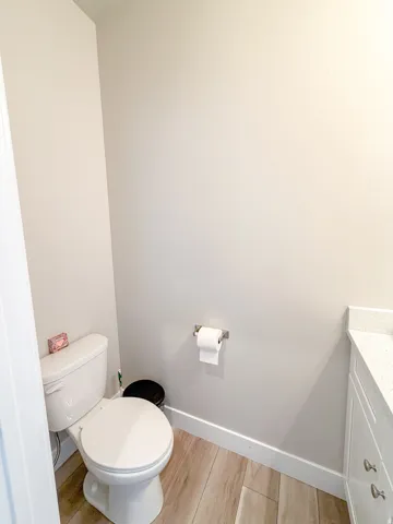 Half bath featuring quartz countertop