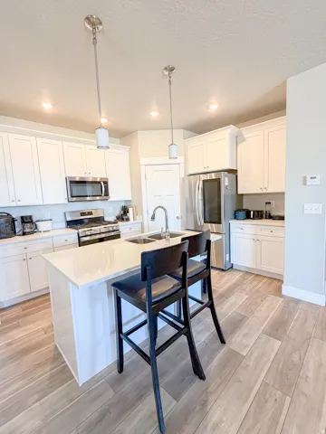 Kitchen Featuring a light colored quartz countertop