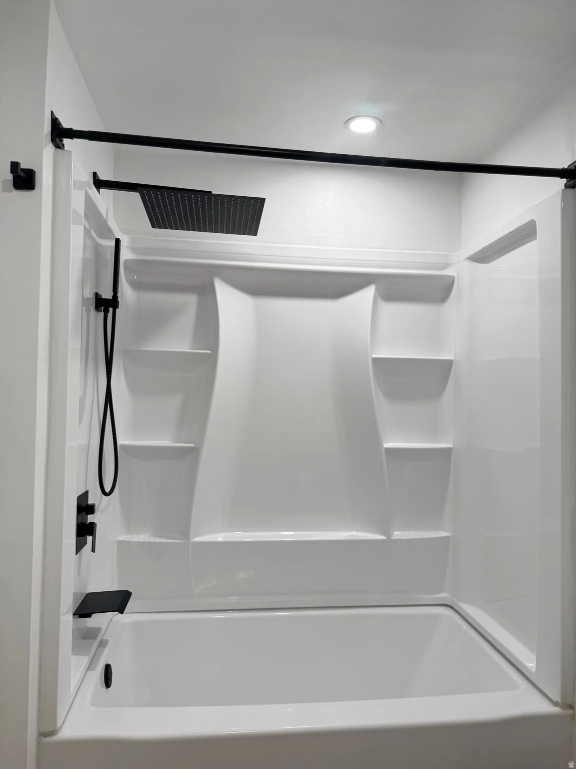 Bathroom featuring shower / washtub combination
