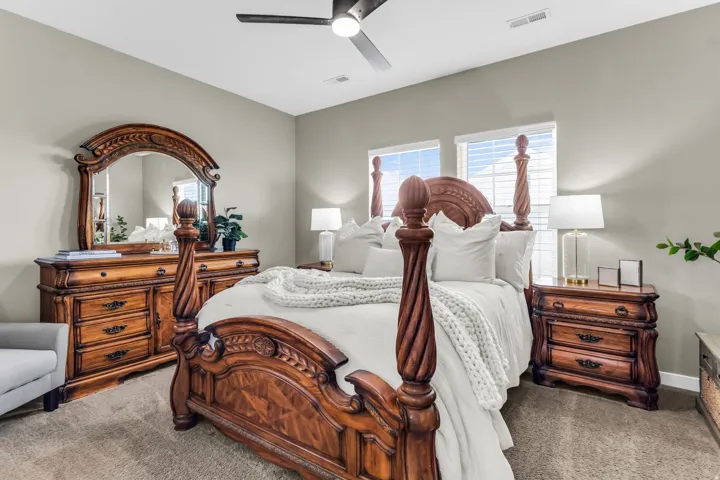 Recessed lighting, ceiling fan, neutral wall tones, and dual windows with blinds