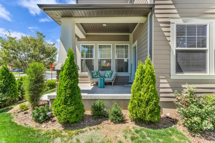 Inviting covered porch with a solid concrete surface