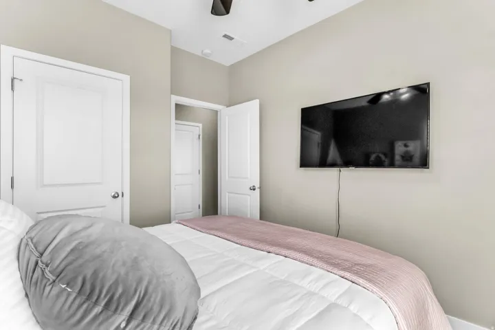 Wall-mounted television with visible wiring