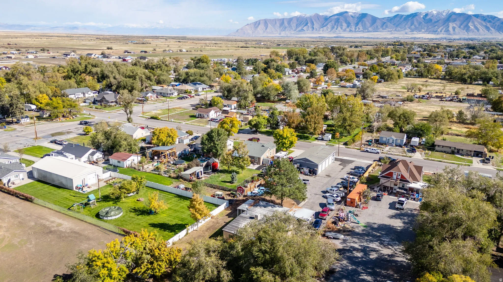 Aerial perspective of suburban area with a mountainous background
