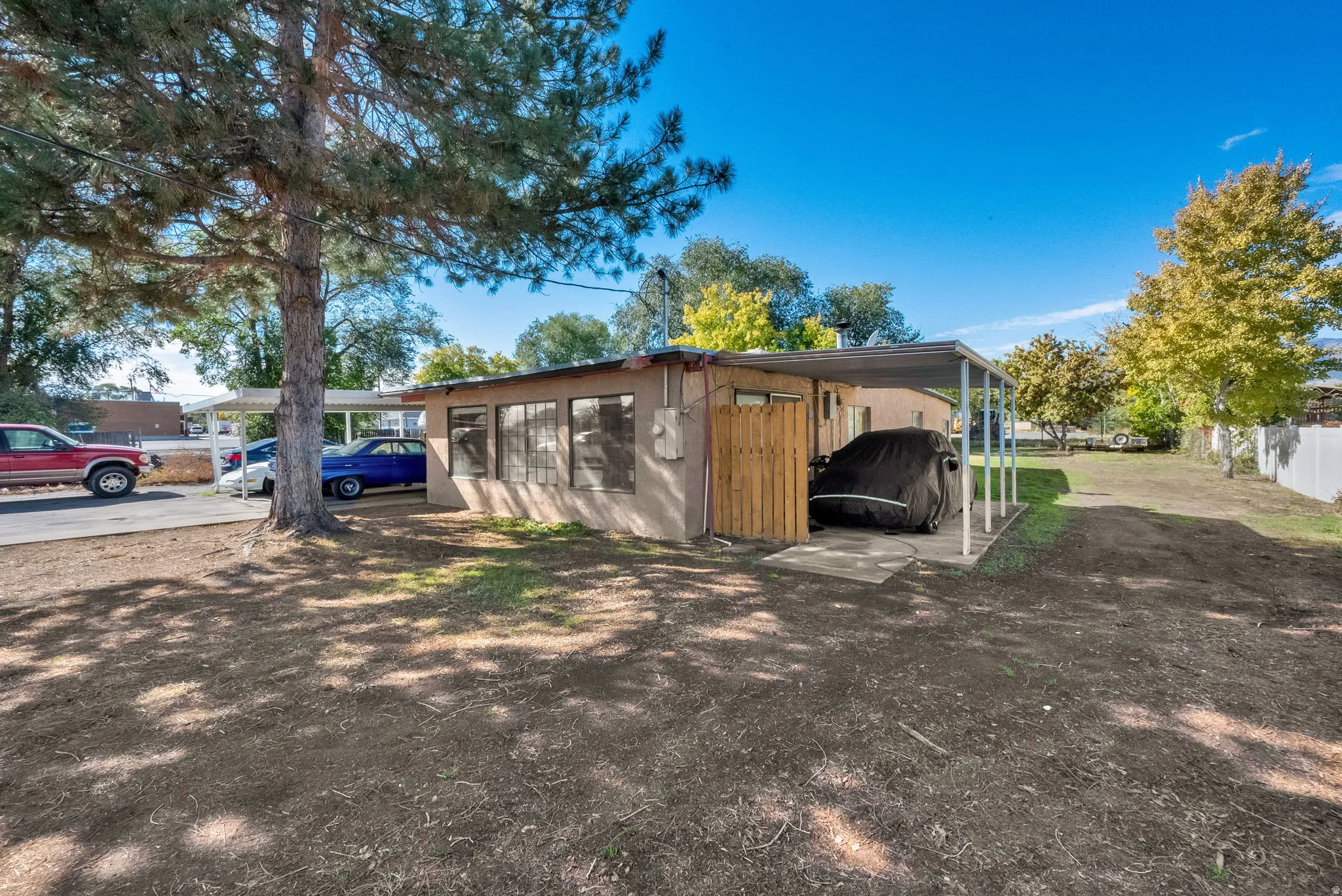 View of outbuilding featuring an attached carport