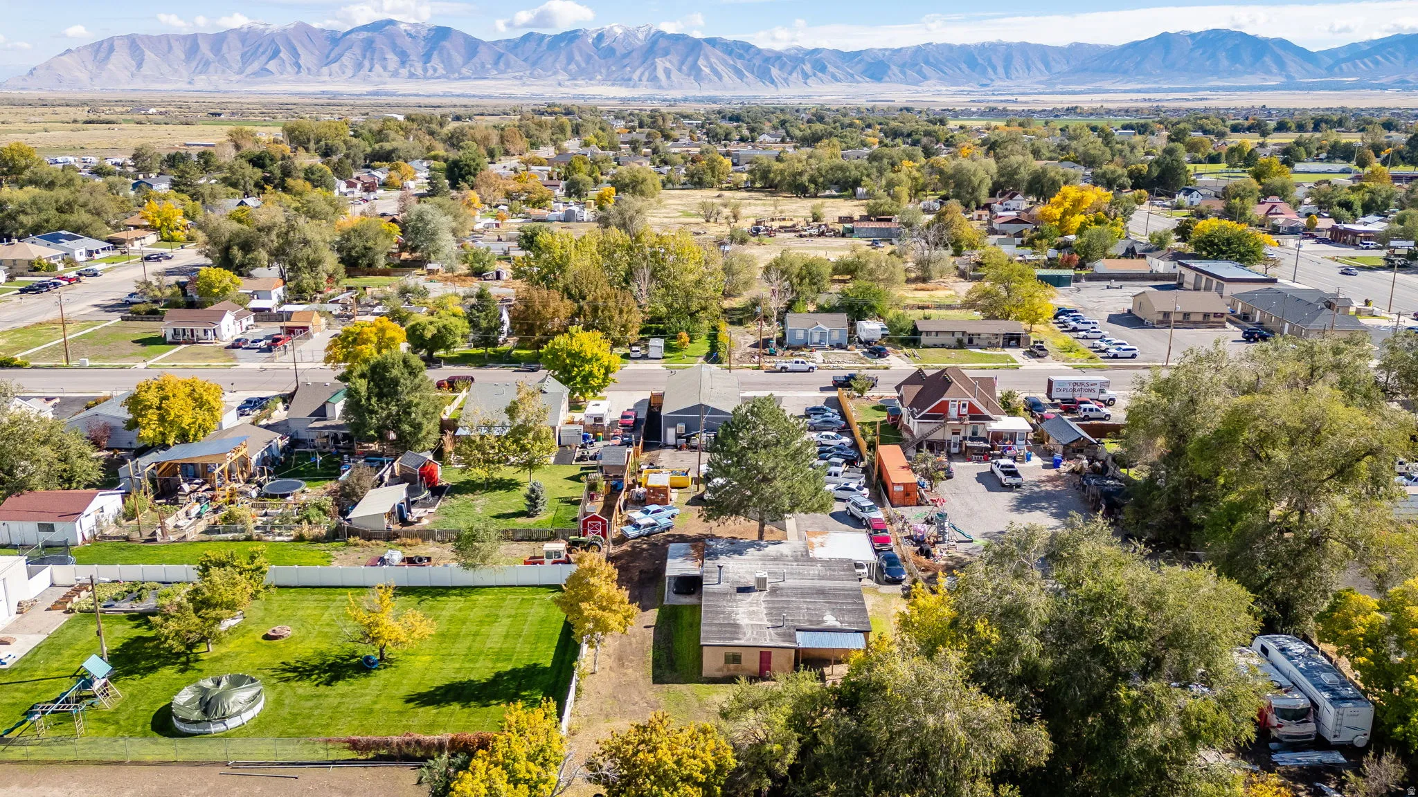 Aerial perspective of suburban area with a mountain backdrop