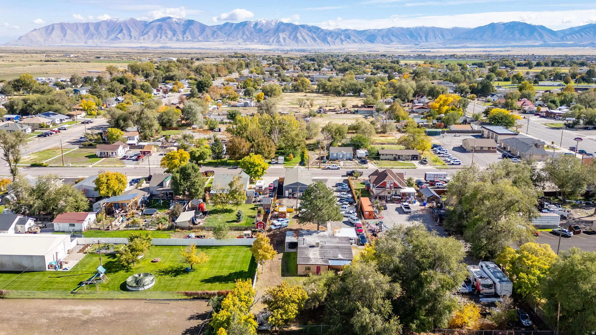 Aerial perspective of suburban area with a mountain backdrop