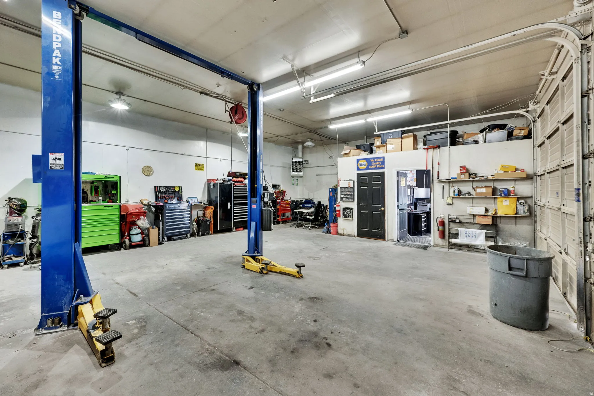 Garage featuring a heating unit