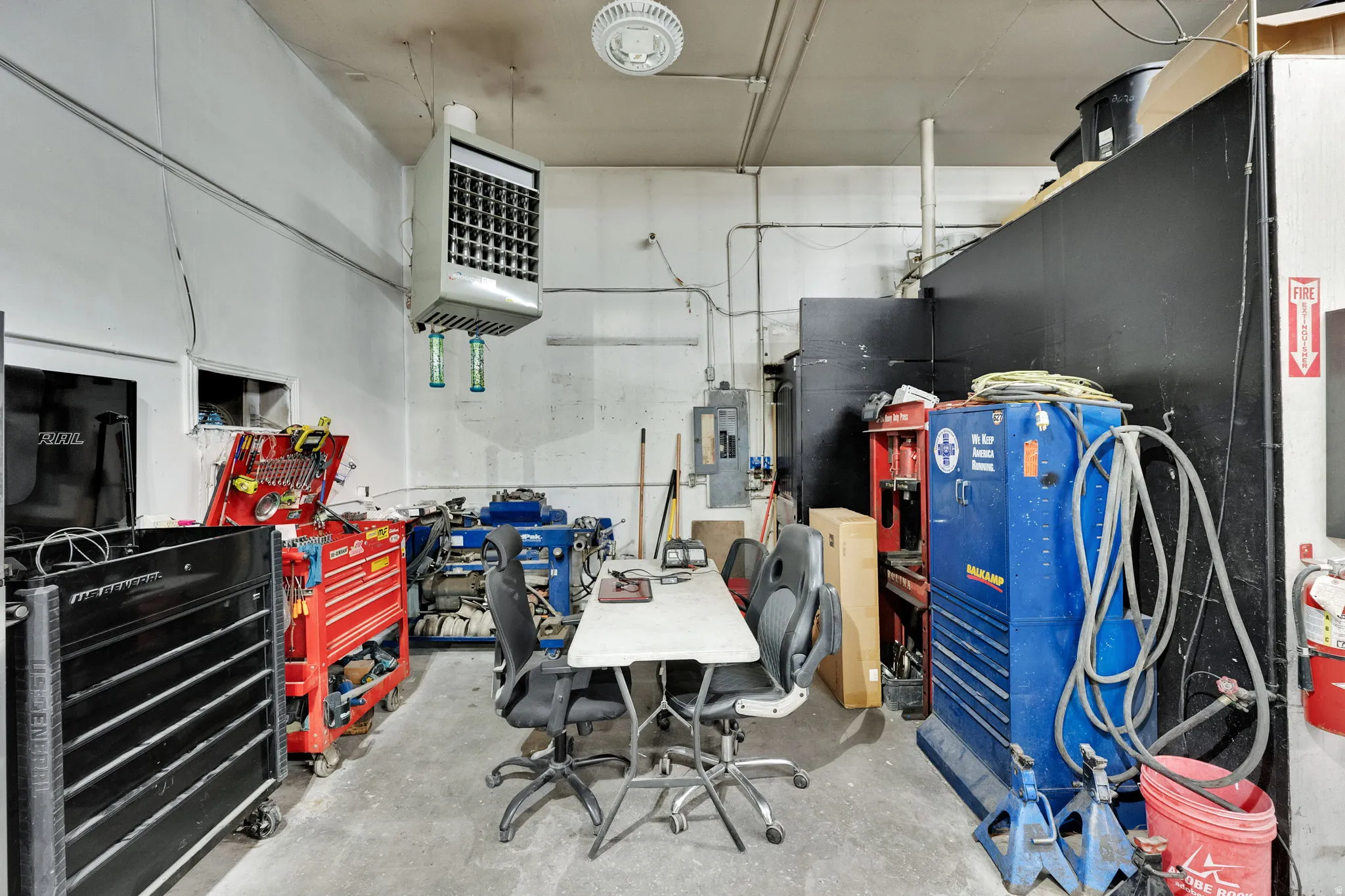 Miscellaneous room featuring a heating unit and electric panel