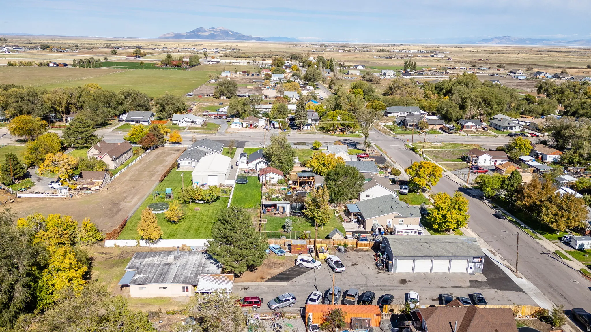 Aerial overview of property's location featuring mountains and nearby suburban area