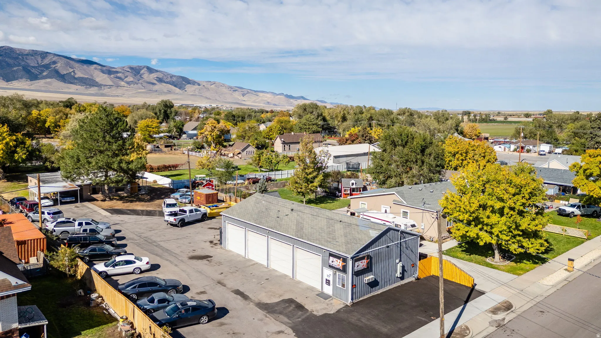 Aerial perspective of suburban area featuring a mountain backdrop