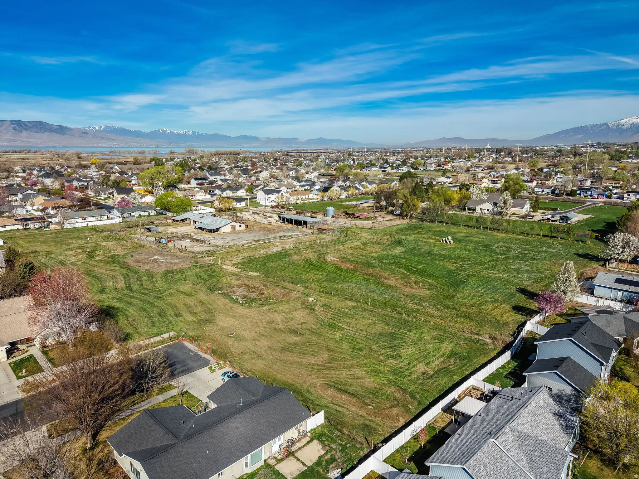 Aerial perspective of suburban area with a mountainous background