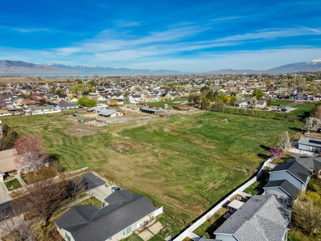 Aerial perspective of suburban area with a mountainous background