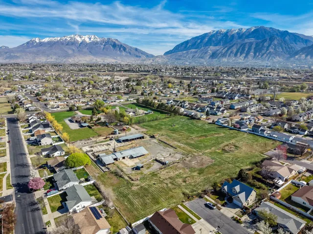 Aerial perspective of suburban area with a mountainous background
