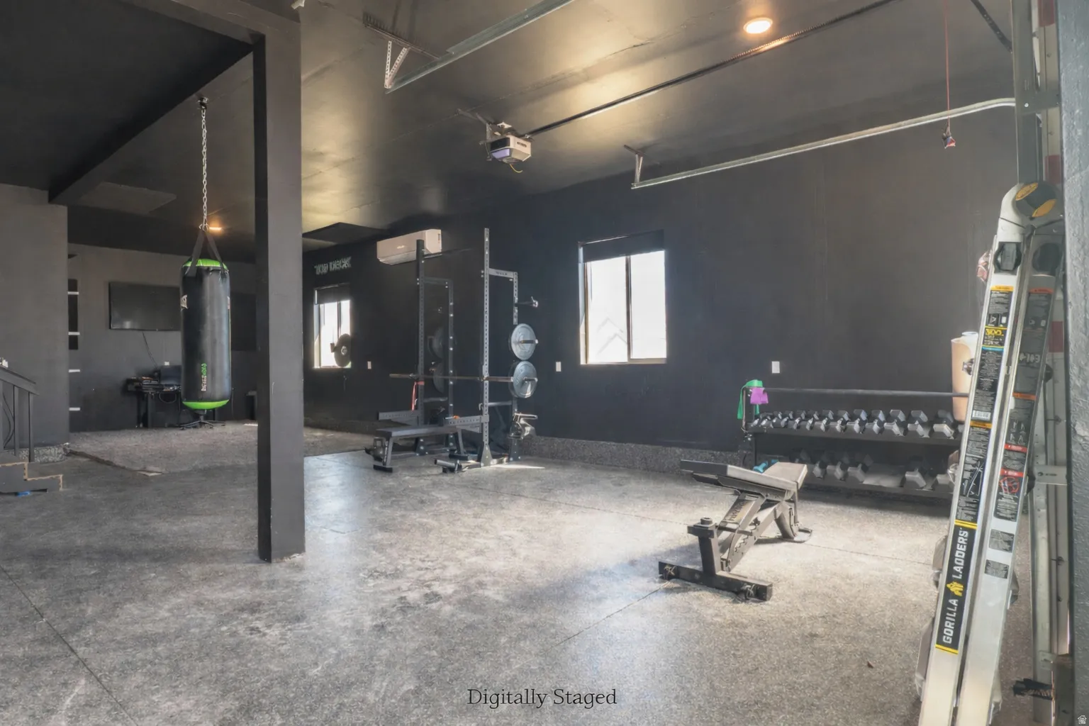 Exercise room featuring a garage