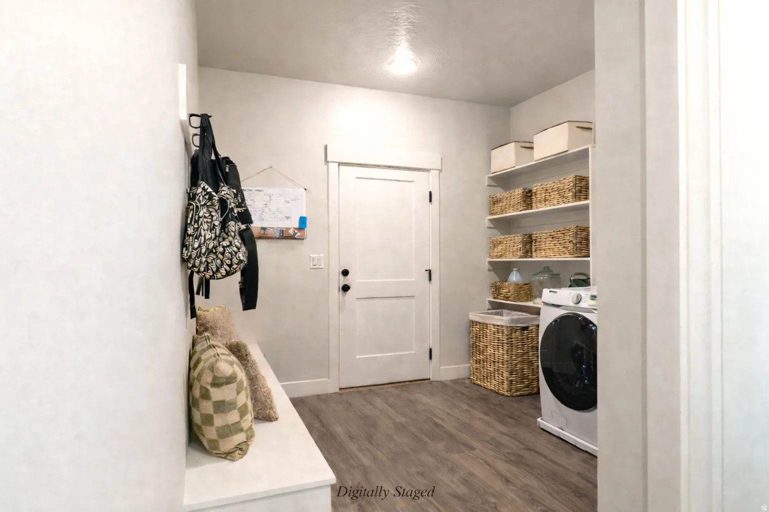 Laundry area featuring washer / dryer and dark wood-style floors