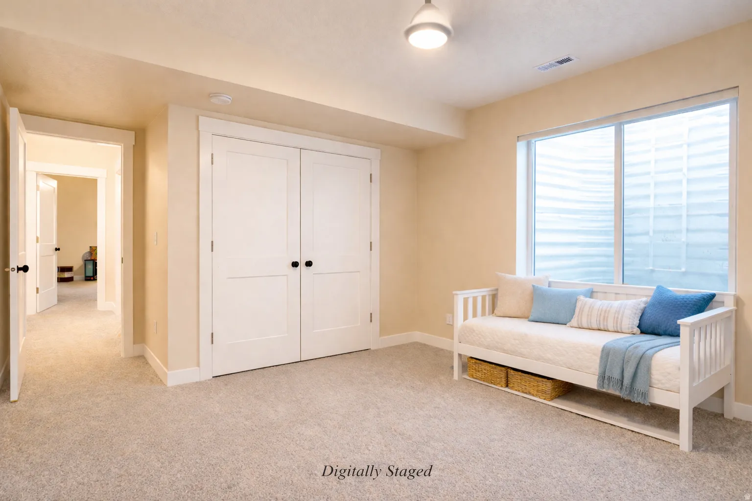 Sitting room with light colored carpet