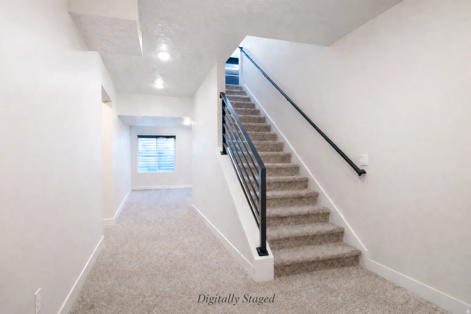 Stairway with carpet flooring and baseboards
