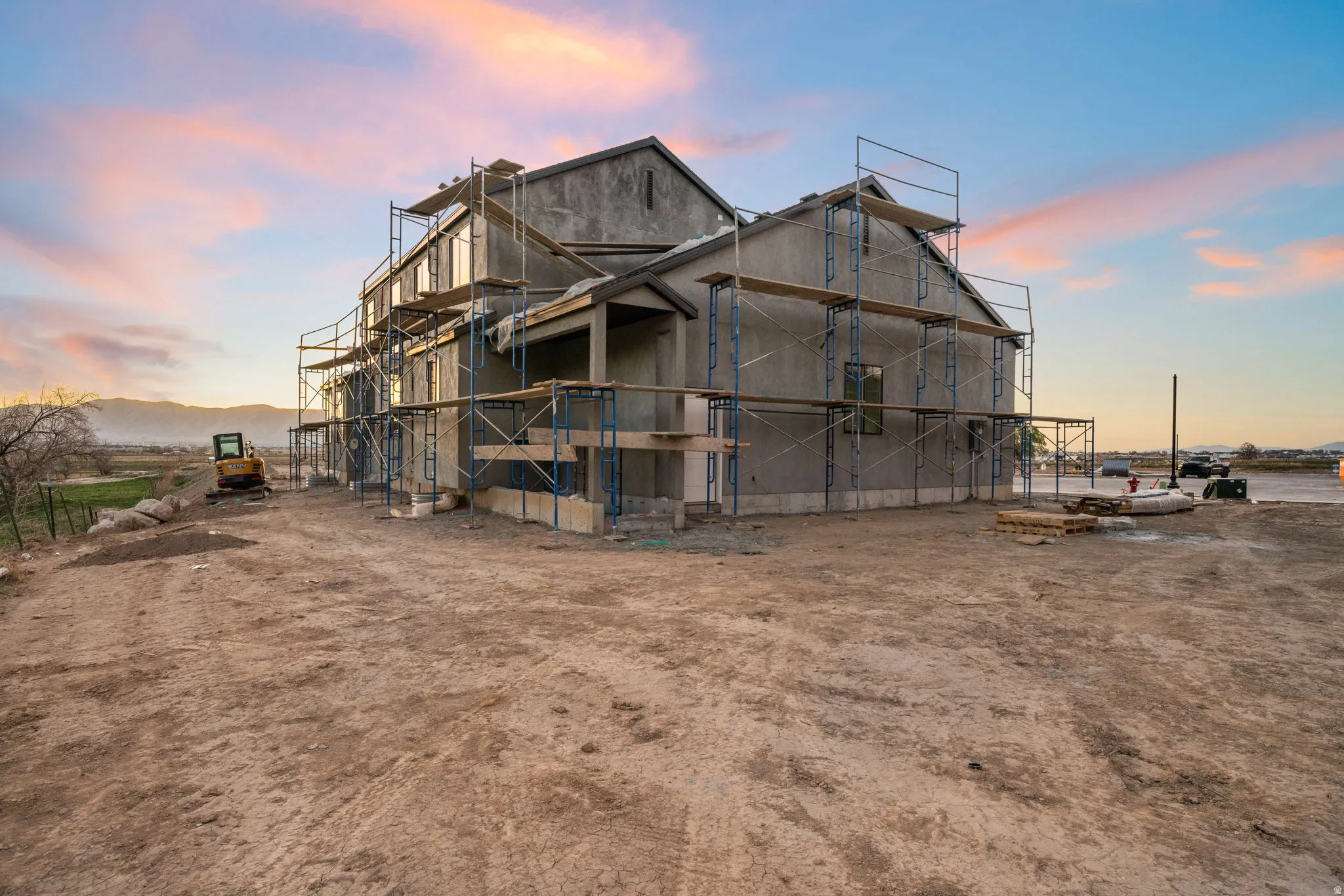 Rear view of house featuring an outbuilding
