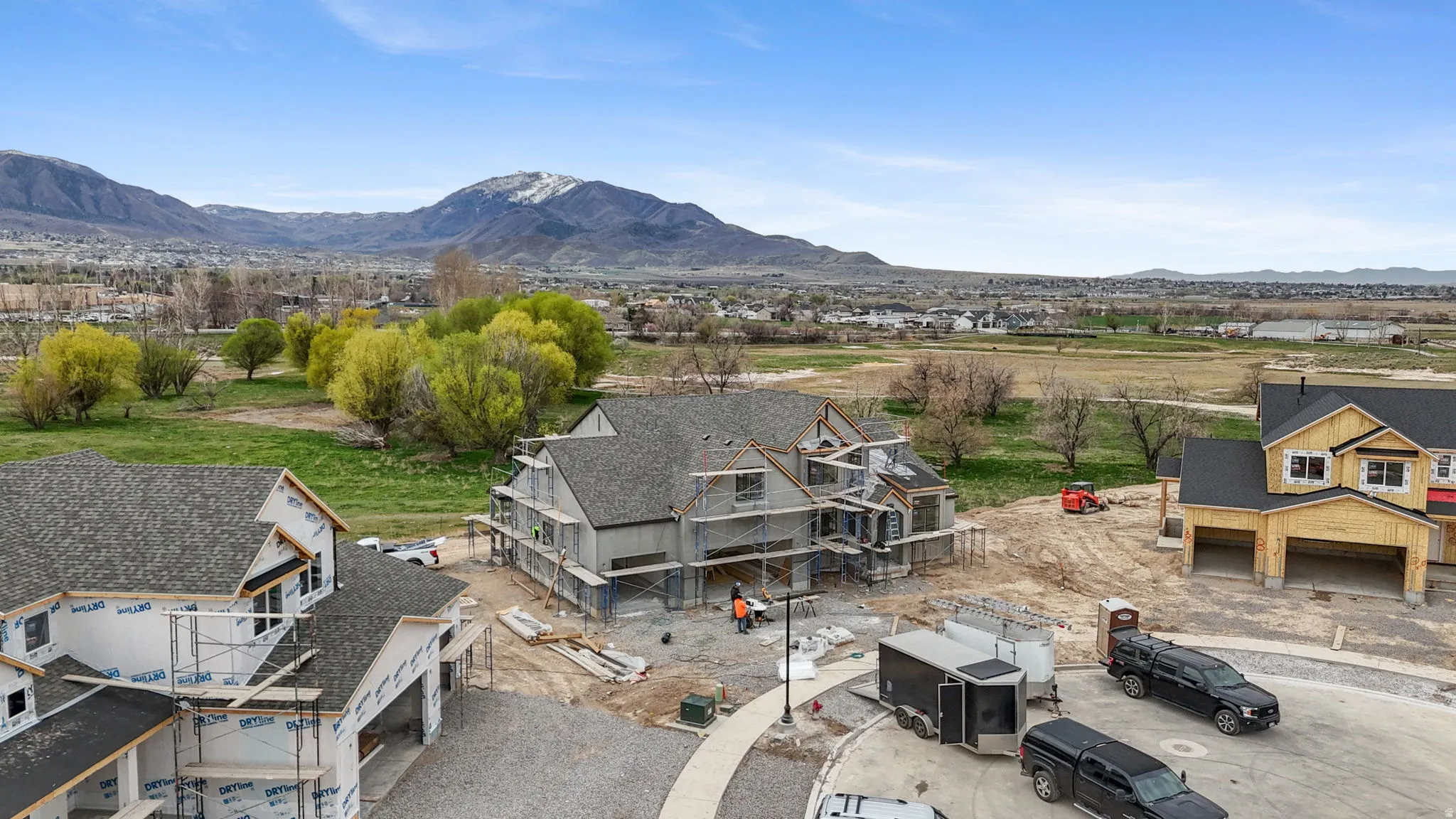Aerial perspective of suburban area featuring a mountain backdrop
