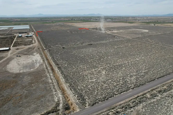 View of property location with a mountain backdrop and rural landscape