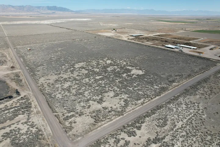 Aerial view of sparsely populated area featuring a mountainous background