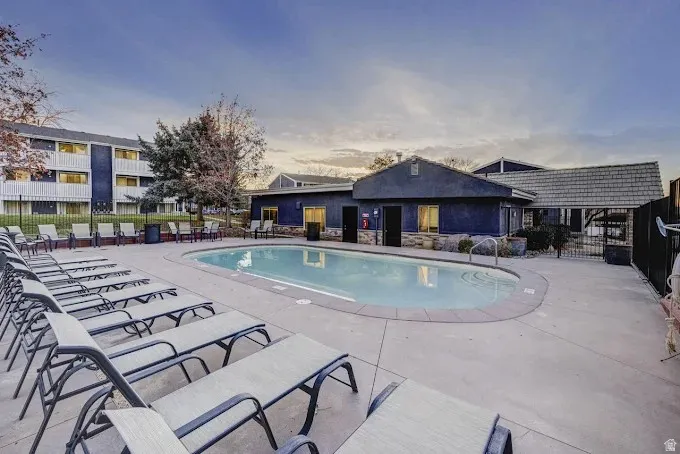 Community pool featuring a patio