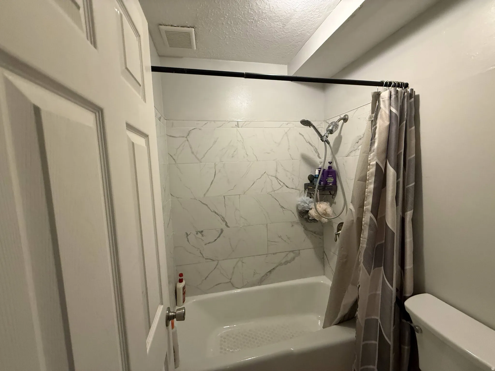 Bathroom featuring shower / bath combination