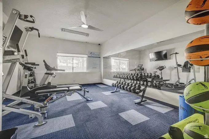 Community Gym featuring a ceiling fan