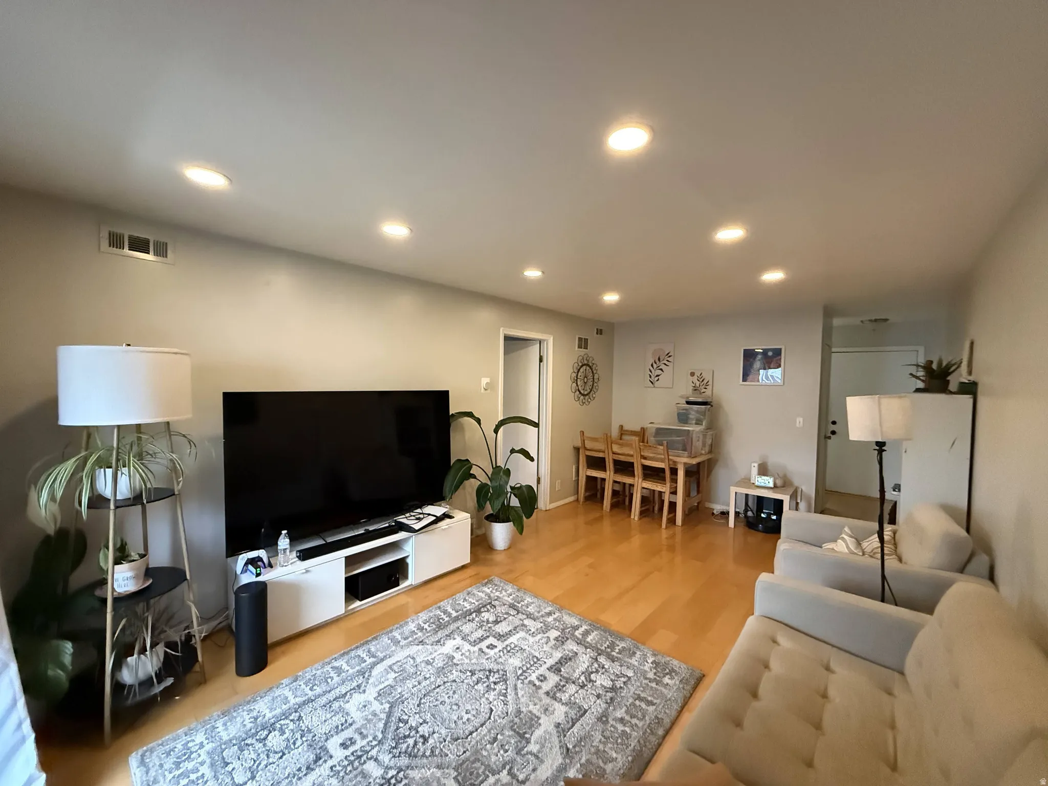 Living room featuring recessed lighting and light wood finished floors