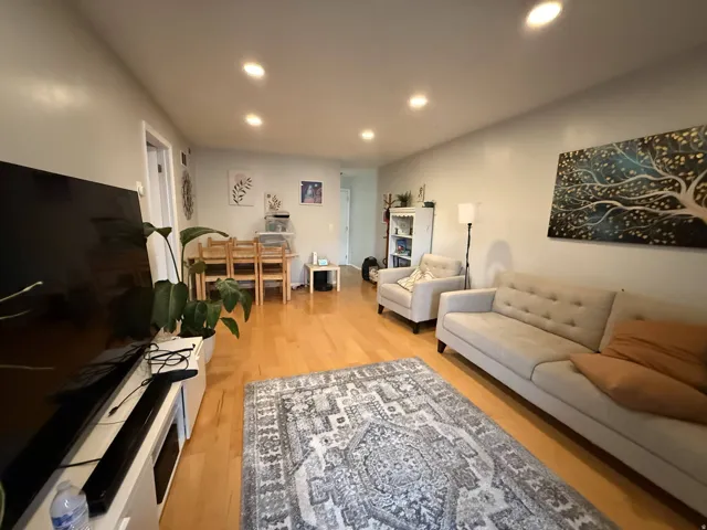 Living room featuring recessed lighting and light wood-style flooring