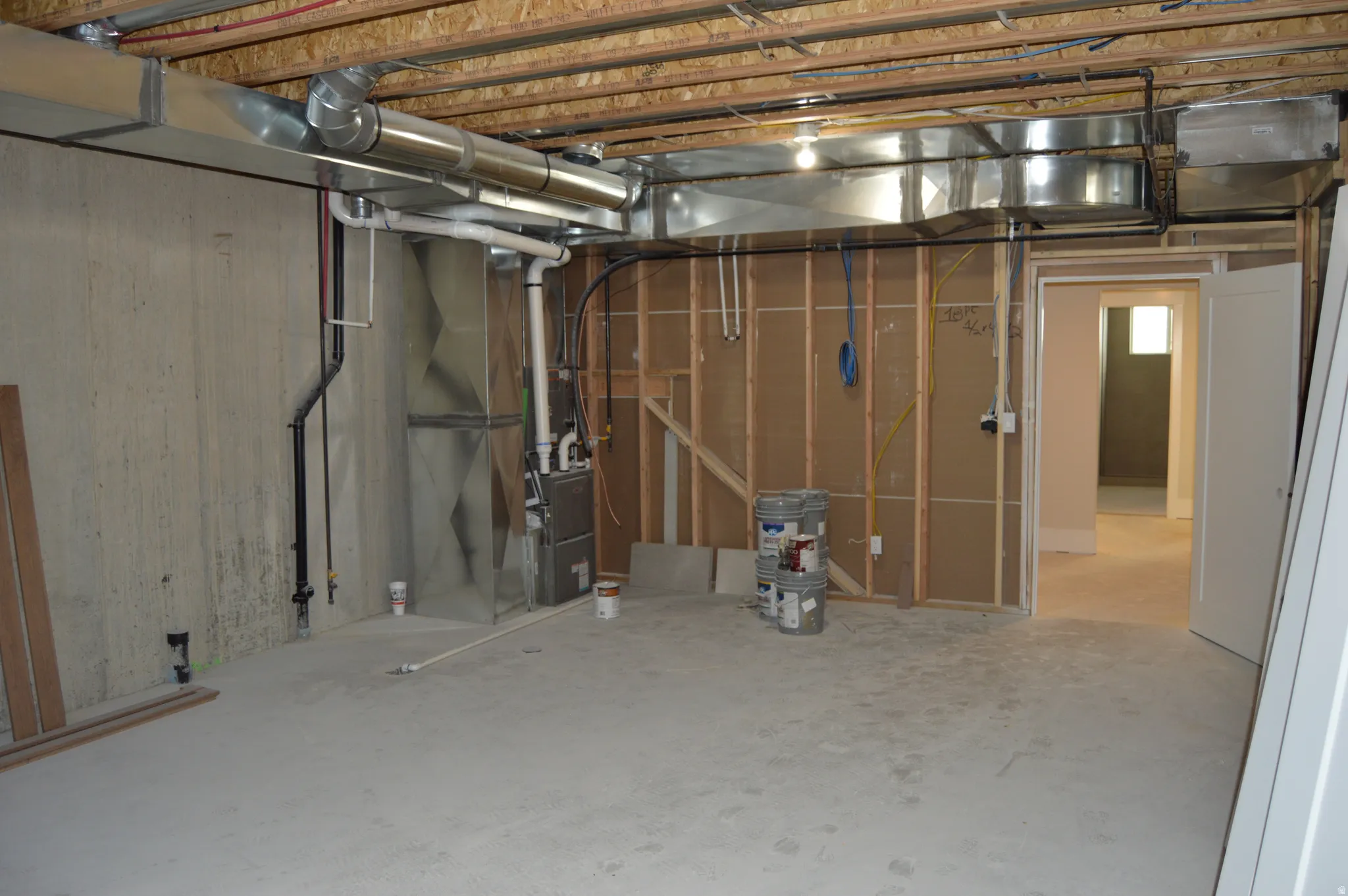 Unfinished basement with heating unit