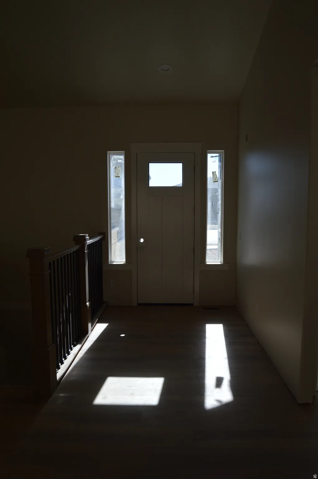 Foyer entrance with dark wood finished floors