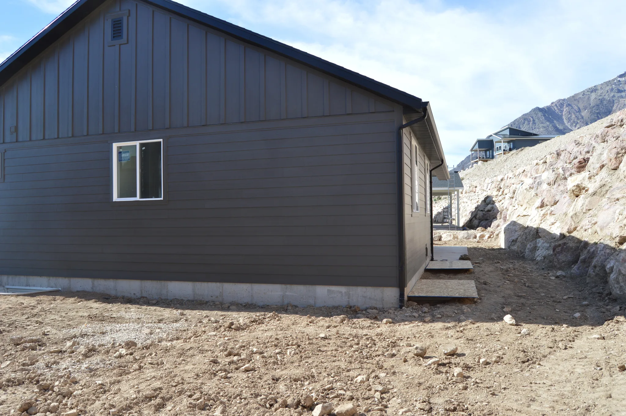 View of property exterior with board and batten siding