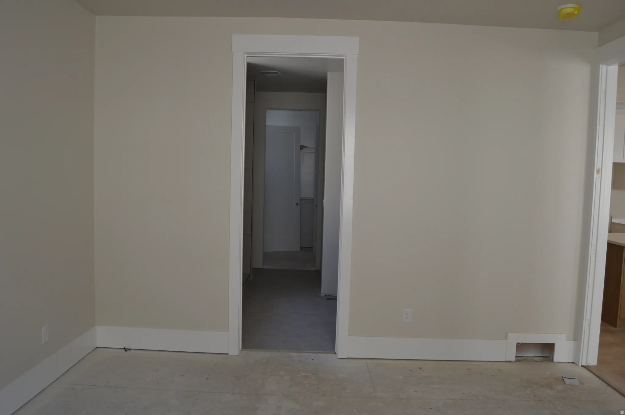 Empty room featuring baseboards