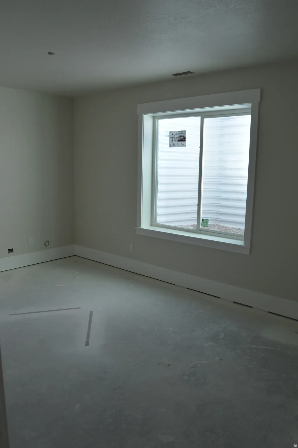 Unfurnished room with baseboards