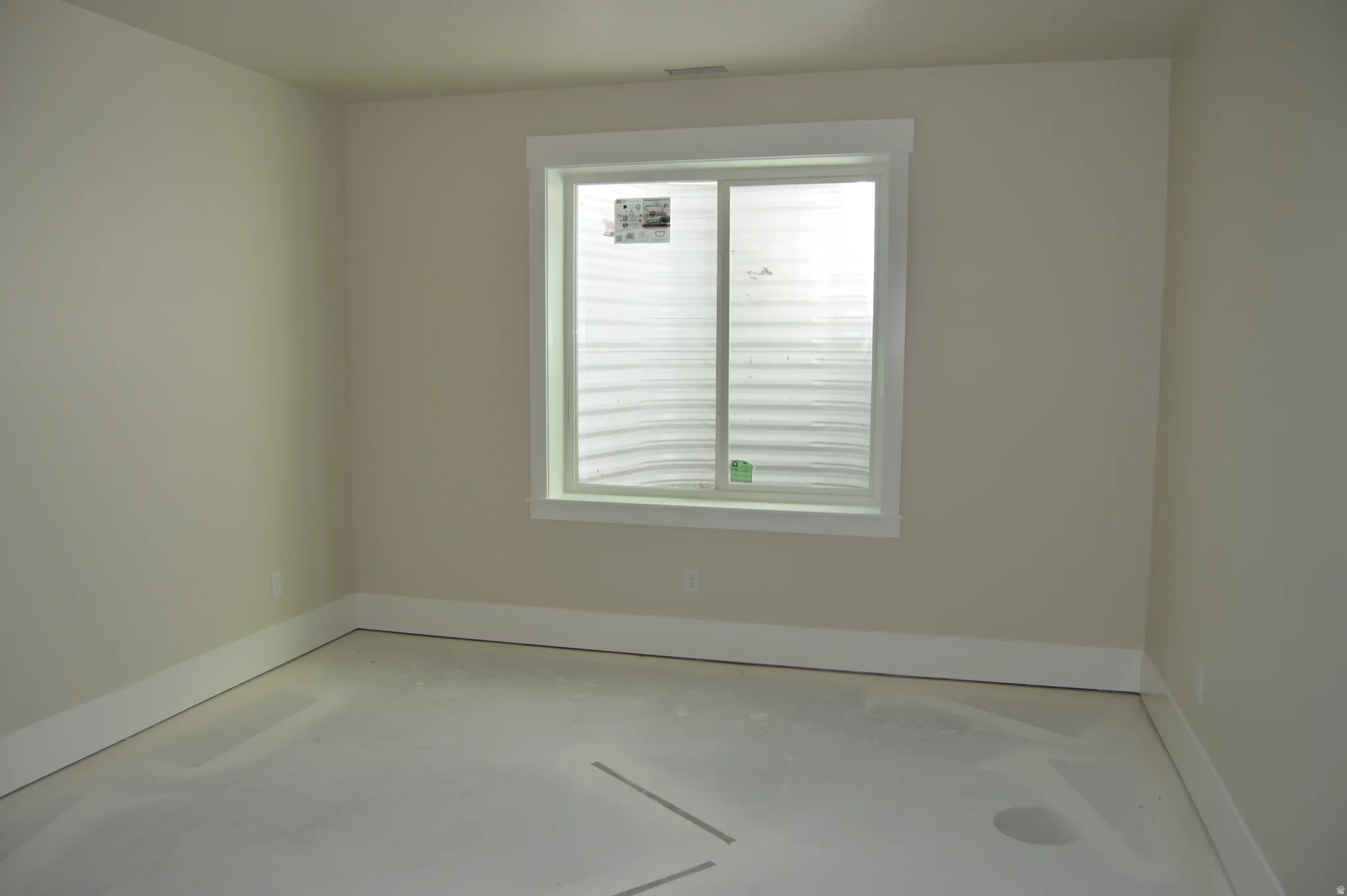 Spare room featuring baseboards