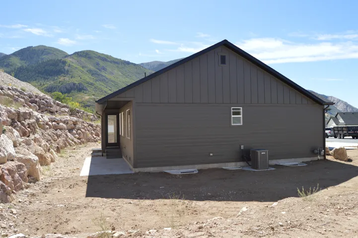 Exterior siding in a dark gray finish