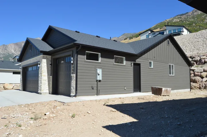 Contemporary exterior featuring horizontal siding and stone accents