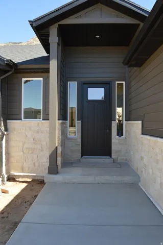 Covered entry with stone facade accents