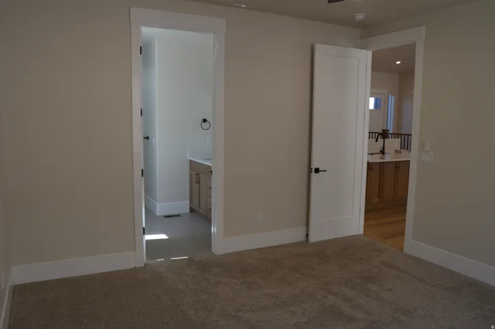 Neutral tone carpeting paired with light-colored walls