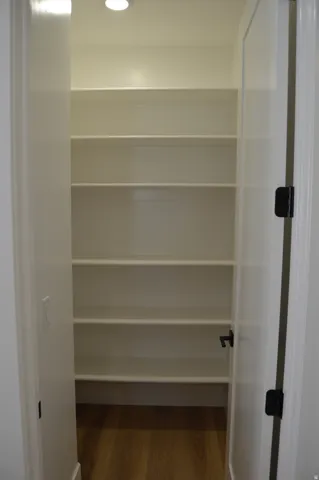 Custom built-in shelving with wood-finish flooring
