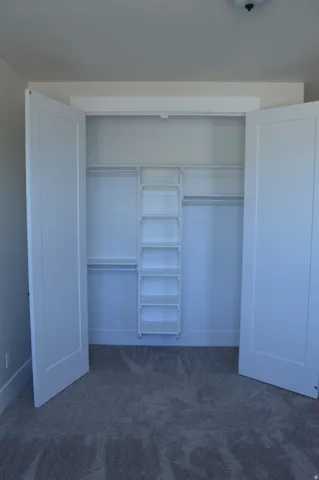 Built-in closet system featuring shelving and hanging rods