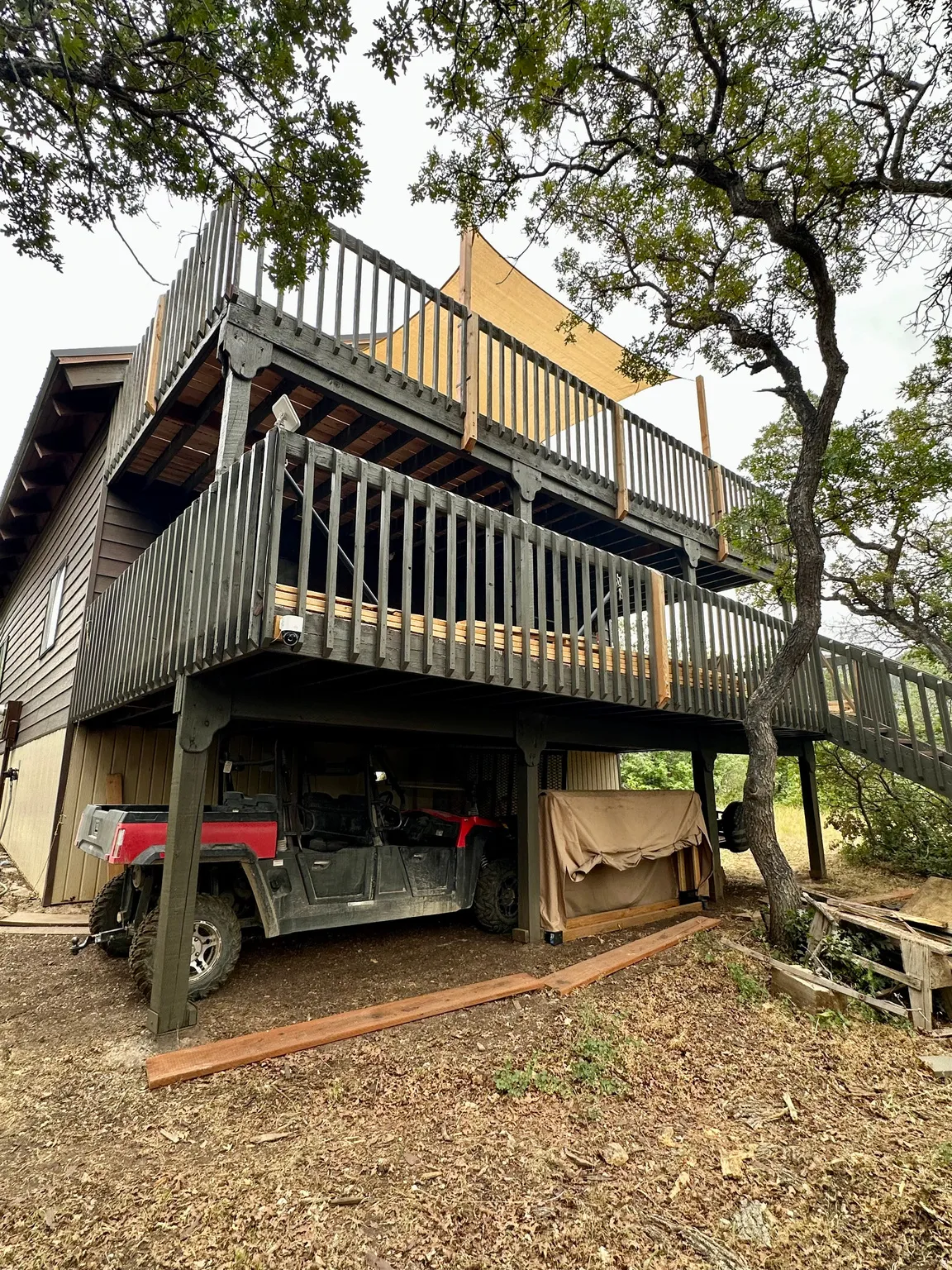 Back of house with a deck
