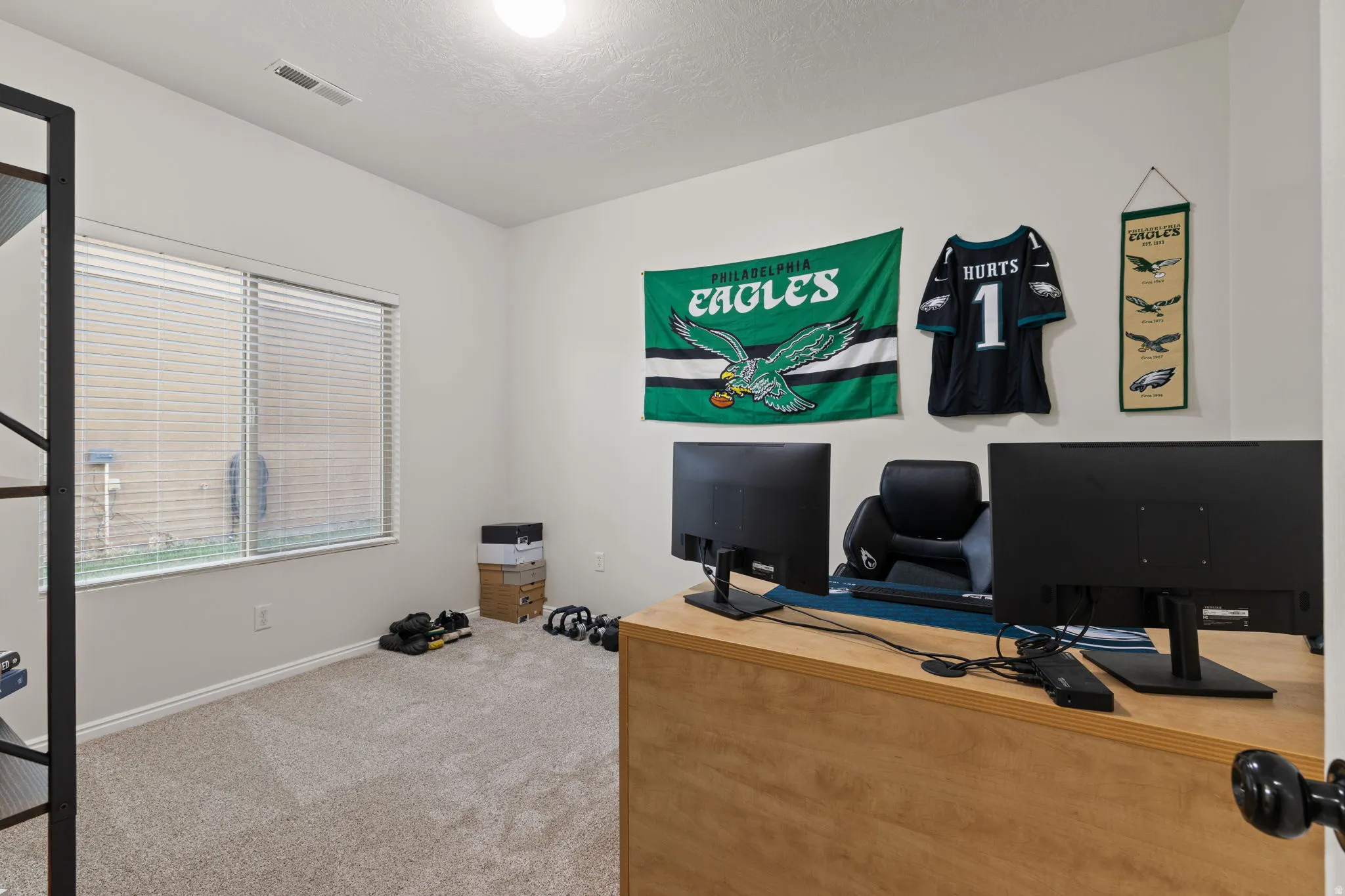 Carpeted office with baseboards