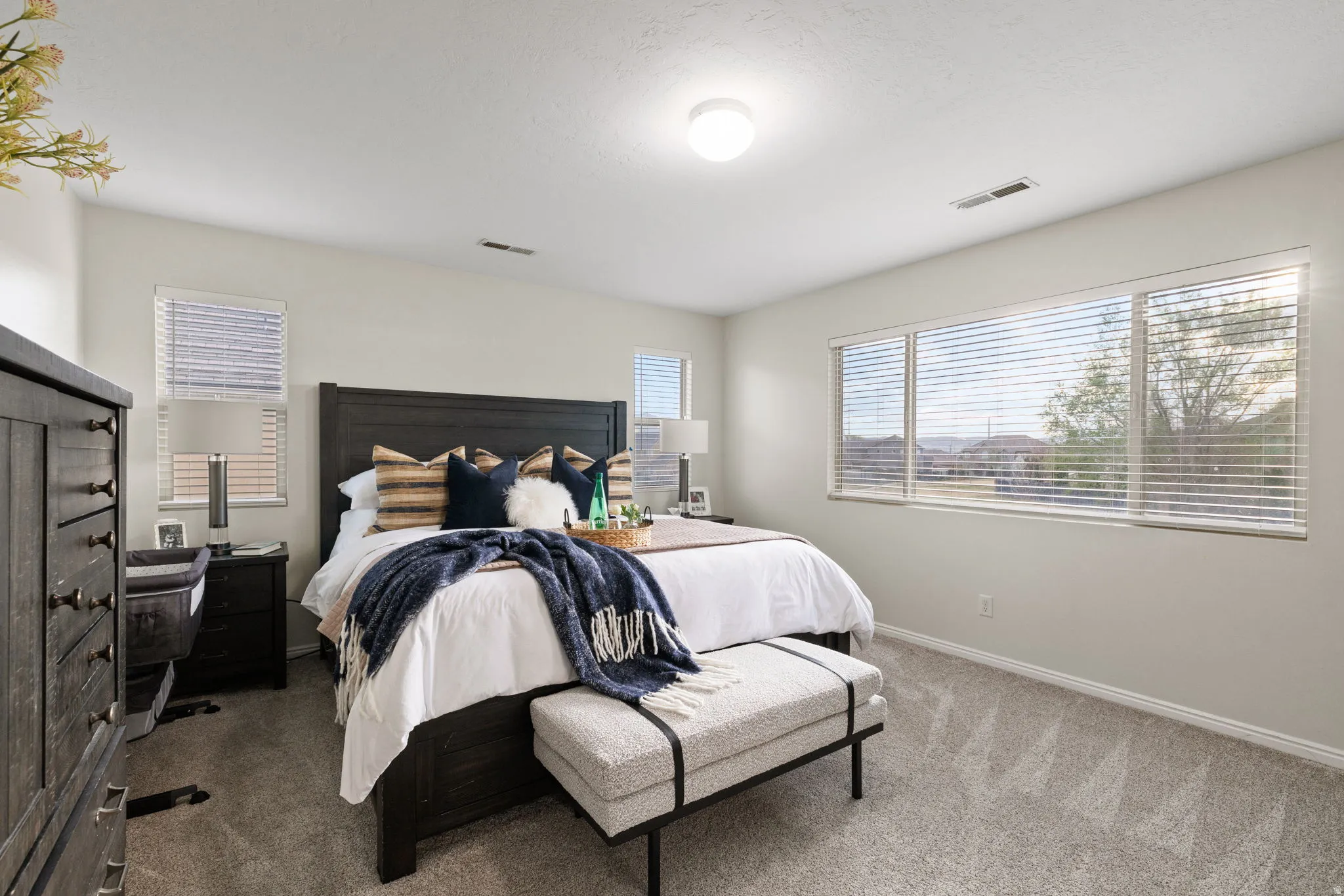 Carpeted bedroom with baseboards