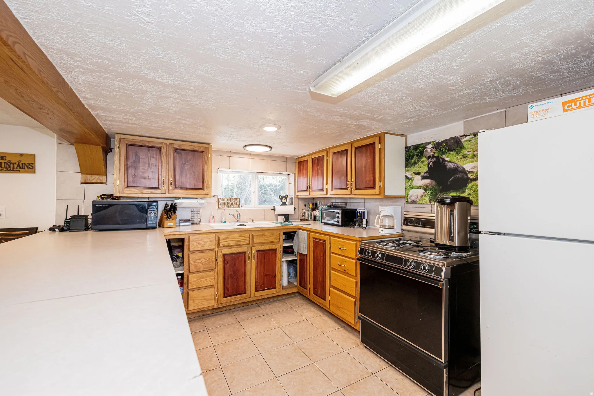 Kitchen with gas-range & refrigerator included