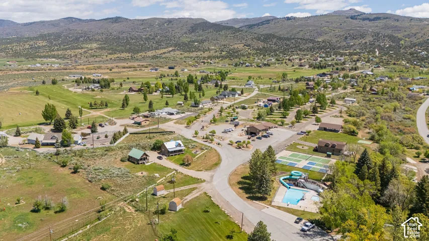 Aerial overview of property's location with mountains and a pool area