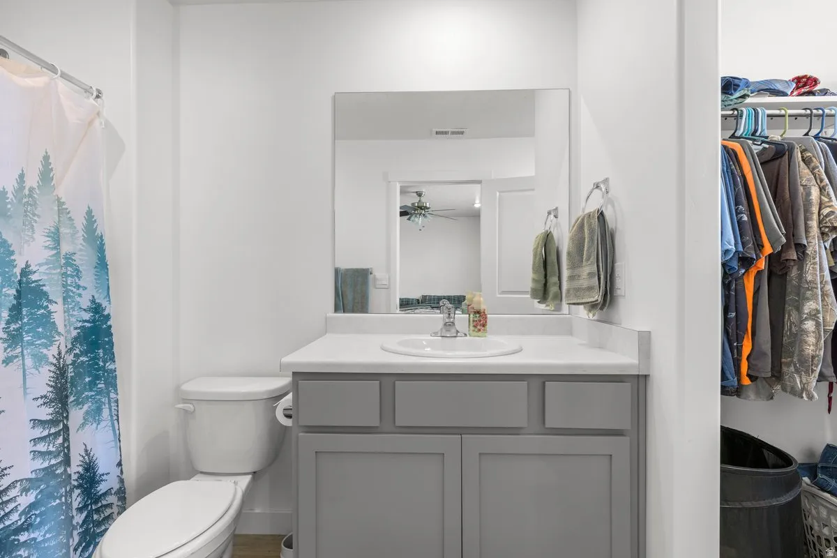Full bathroom with vanity and a shower with curtain