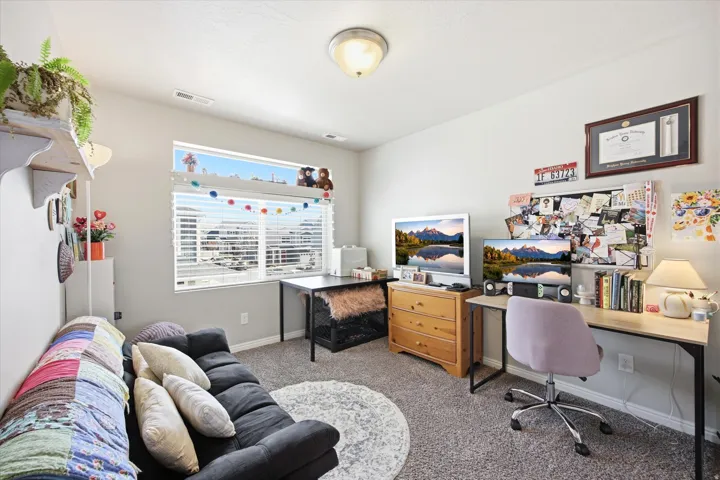 Office featuring light colored carpet and baseboards