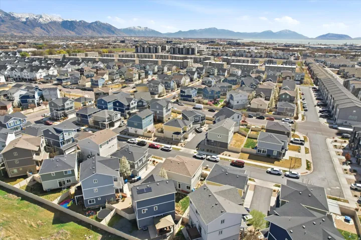 Aerial view of property's location featuring mountains and nearby suburban area